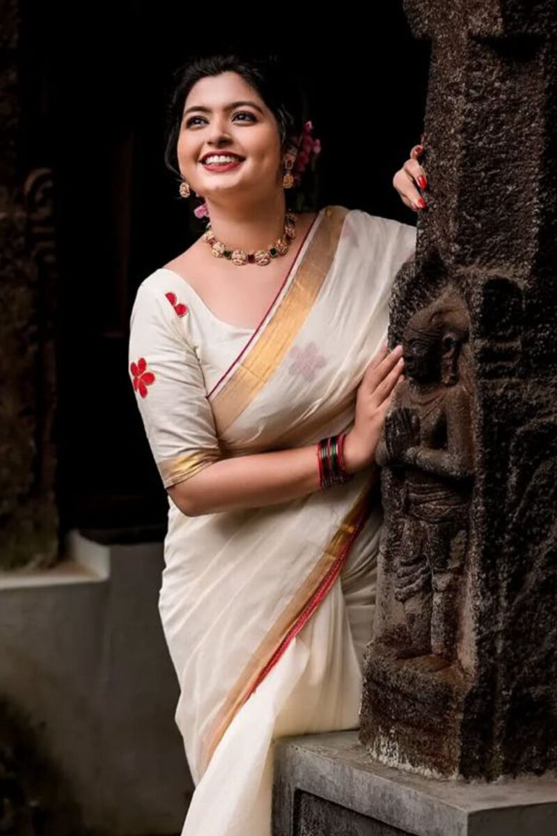 Kasavu Saree With Red Flower Blouse