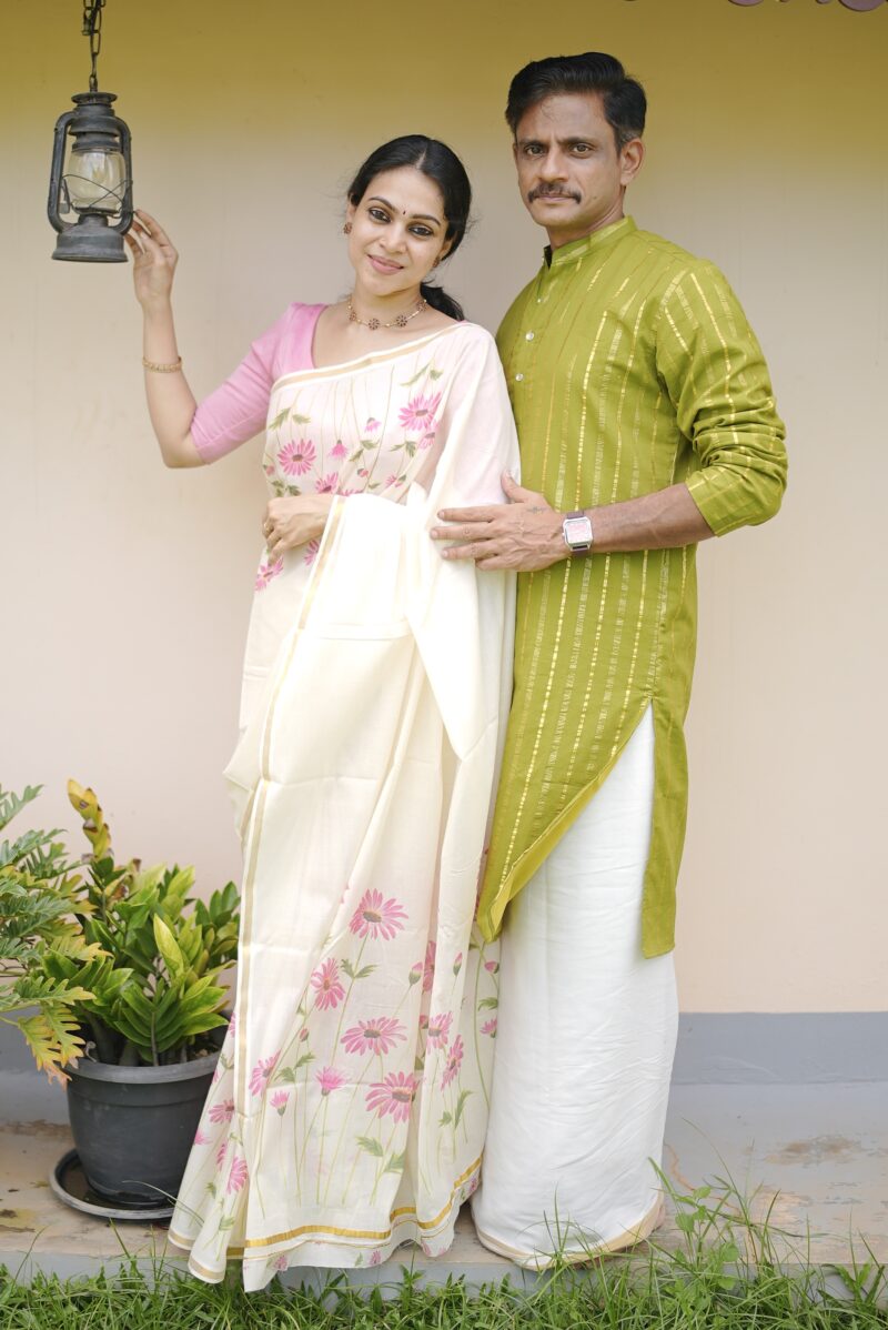 Kerala Kasavu pink floral print cotton saree and Men’s Stripe Kurta